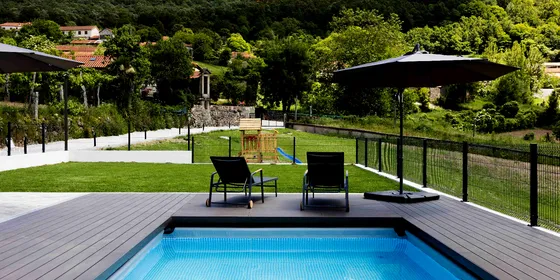 CDECK Original® composite decking in Chocolate around a pool