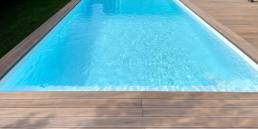 CDECK WUUDE composite decking in soft oak colour in a pool area