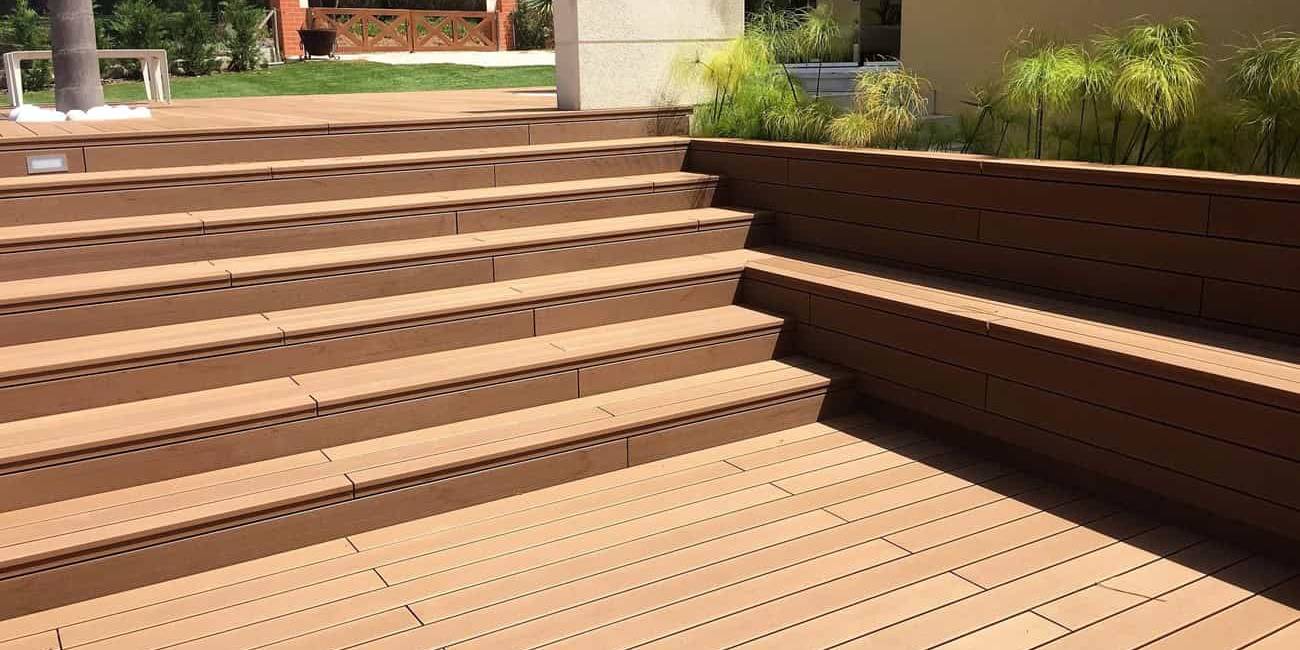 CDECK Original composite decking in redwood colour installed on stairs and in a garden