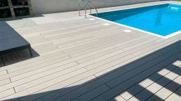 CDECK composite decking in Grey installed in a pool area