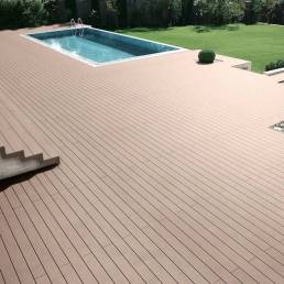 CDECK composite decking in Beech Beige in a pool and garden area 