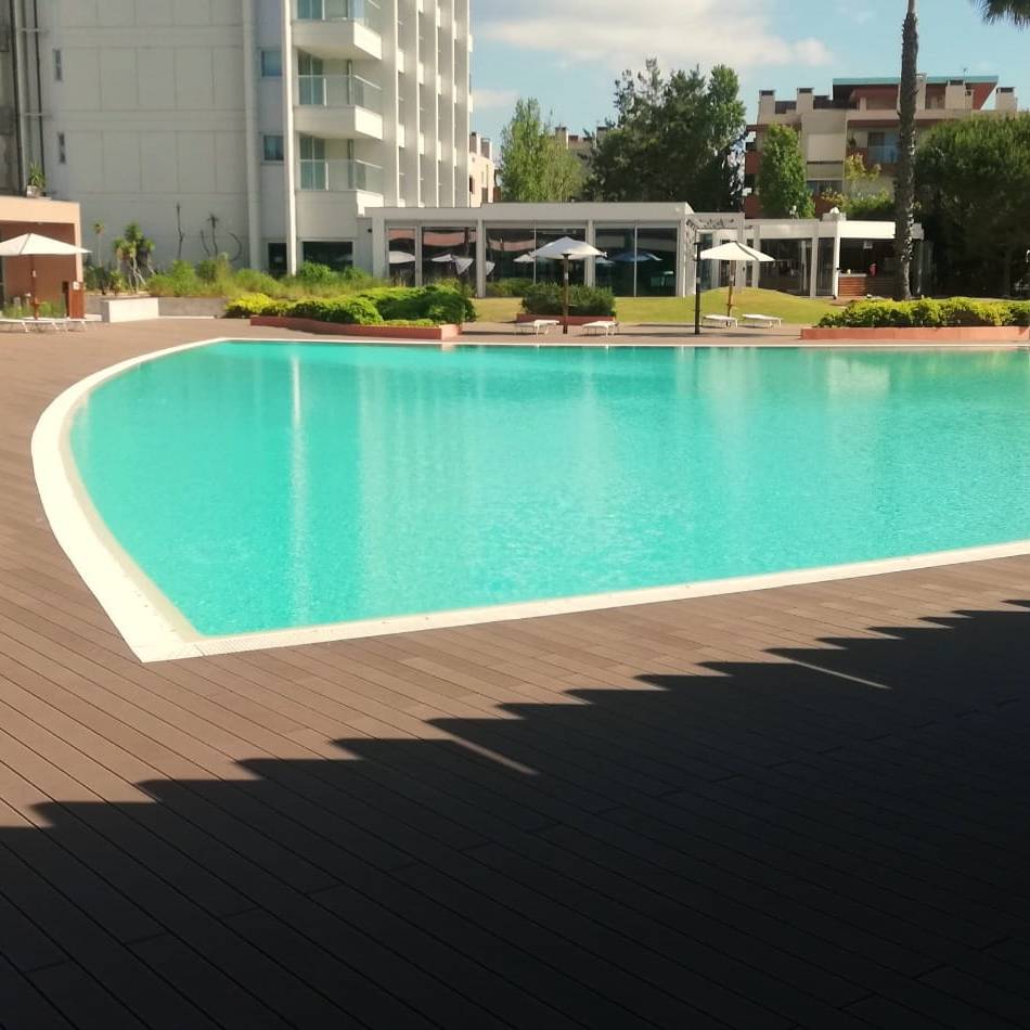 CDECK Composite Decking at the outdoor pool of Aqualuz Troia by The Editory