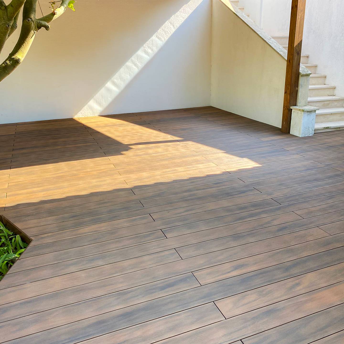 CDECK WUUDE composite decking in American Walnut in a garden 