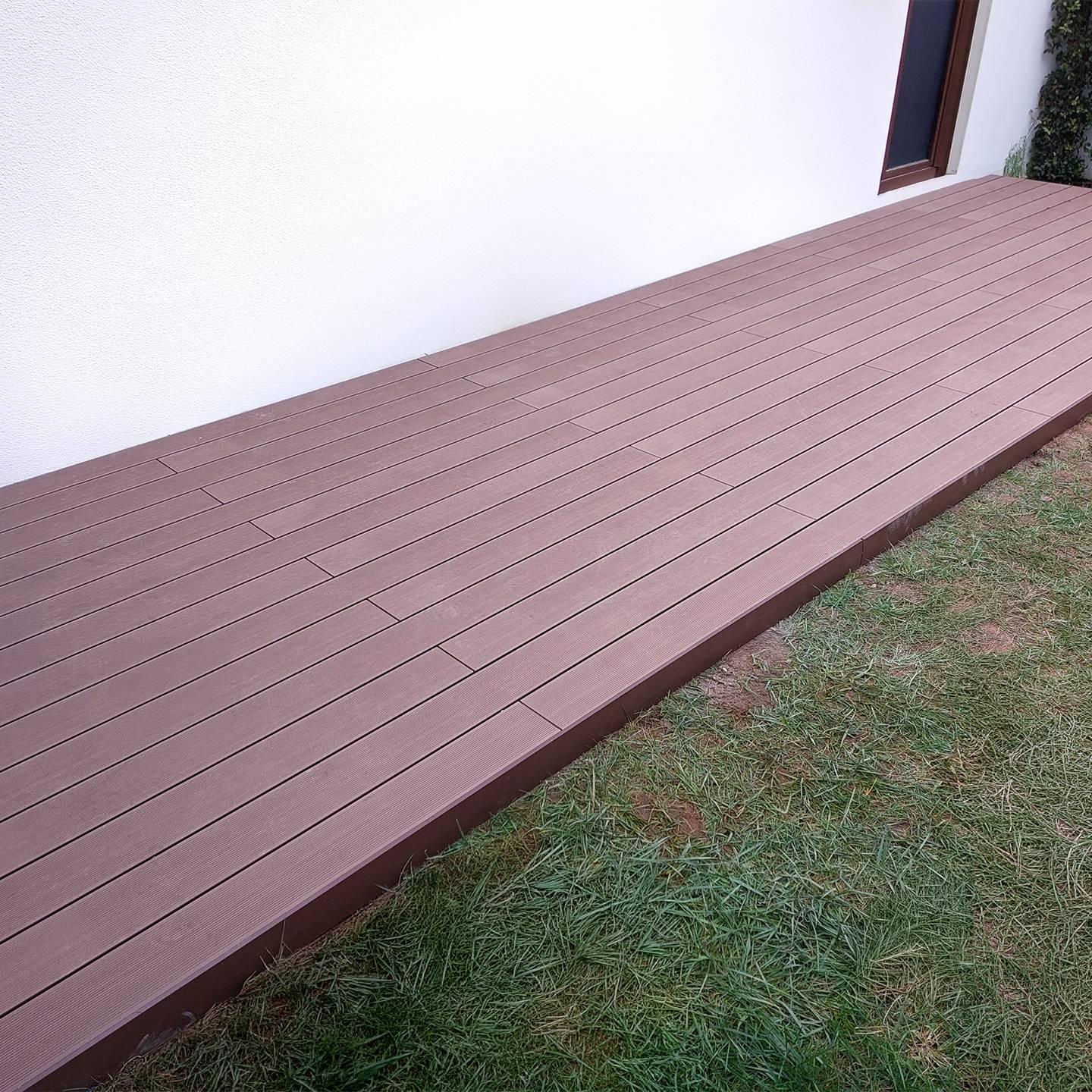 CDECK composite decking in Redwood in a garden 