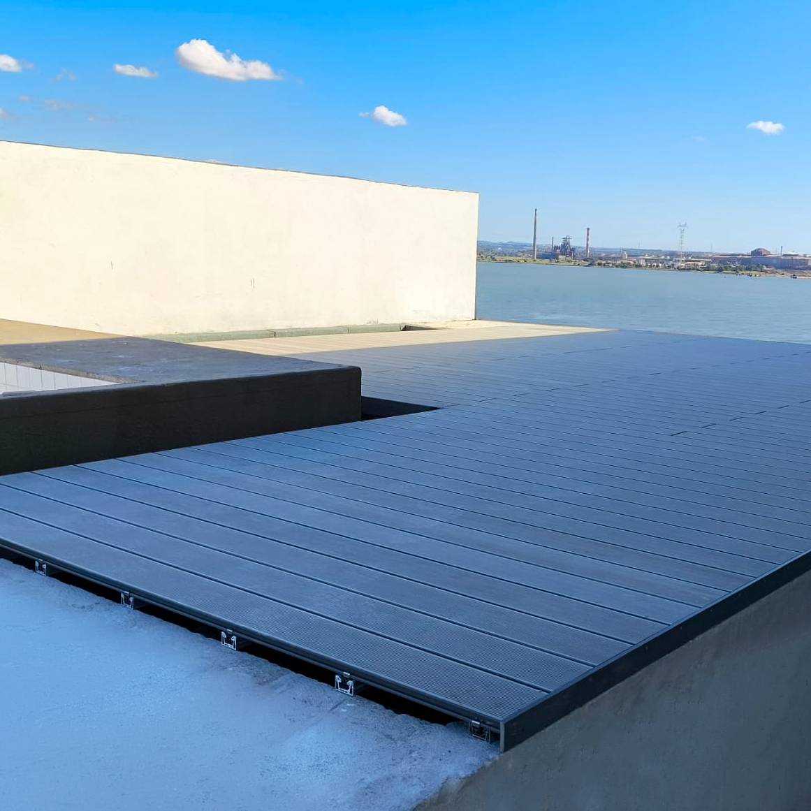 CDECK composite decking installed on a rooftop at Nooba (Setúbal)