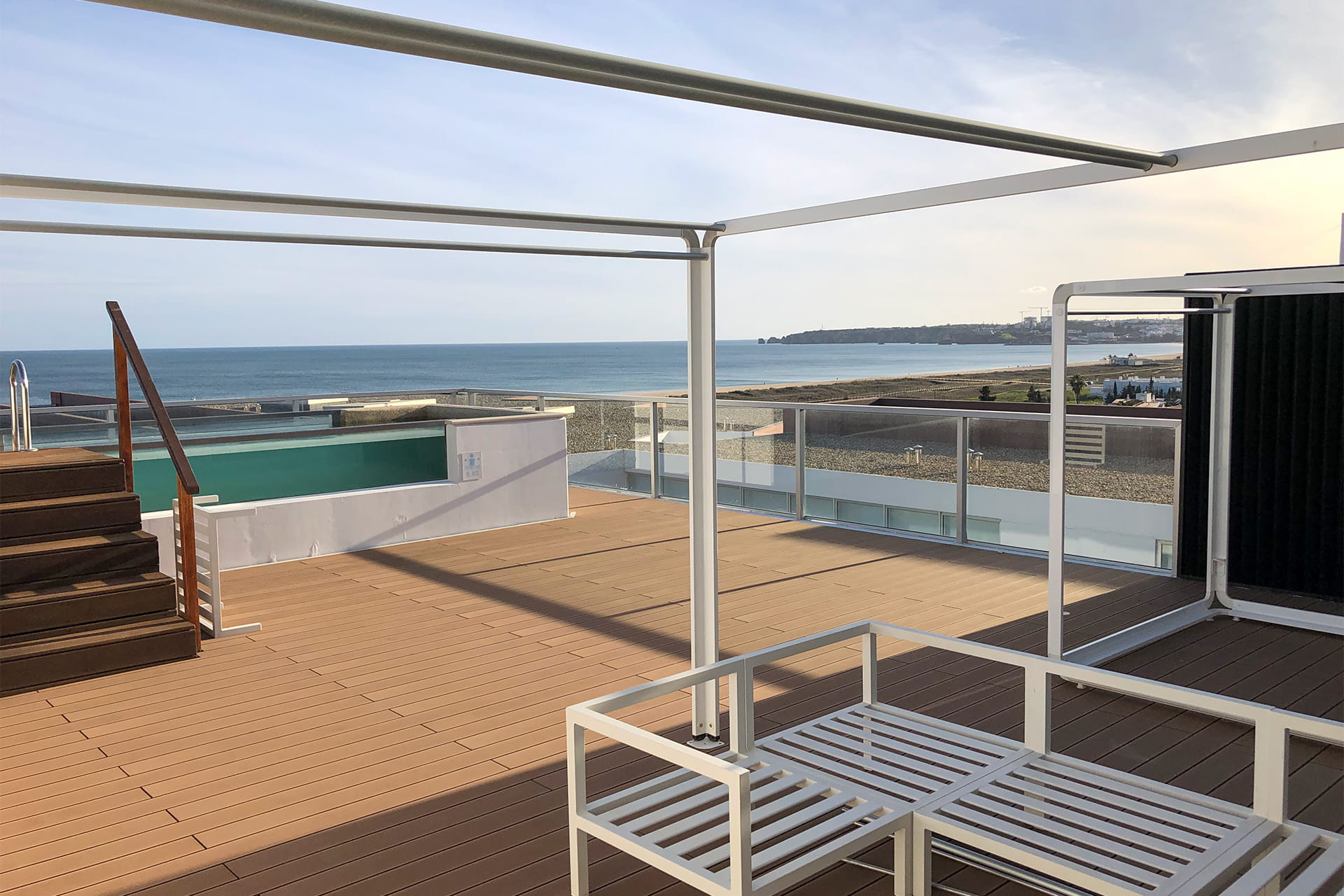 CDECK composite decking in redwood color installed on the balconies of the suites at Iberostar Selection Lagos Algarve