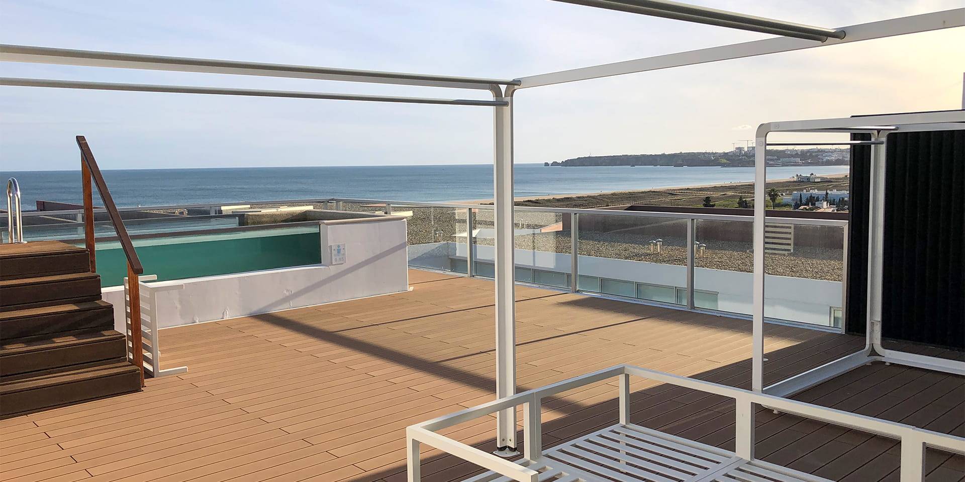 CDECK composite decking in redwood color installed on the balconies of the suites at Iberostar Selection Lagos Algarve