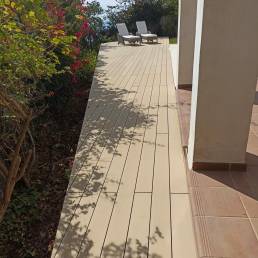 CDECK Original composite decking in beige beech colour in a pool area
