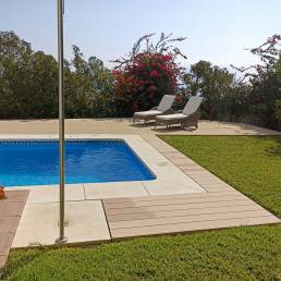 CDECK Original composite decking in beige beech colour in a pool area