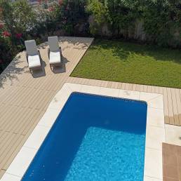 CDECK Original composite decking in beige beech colour in a pool area