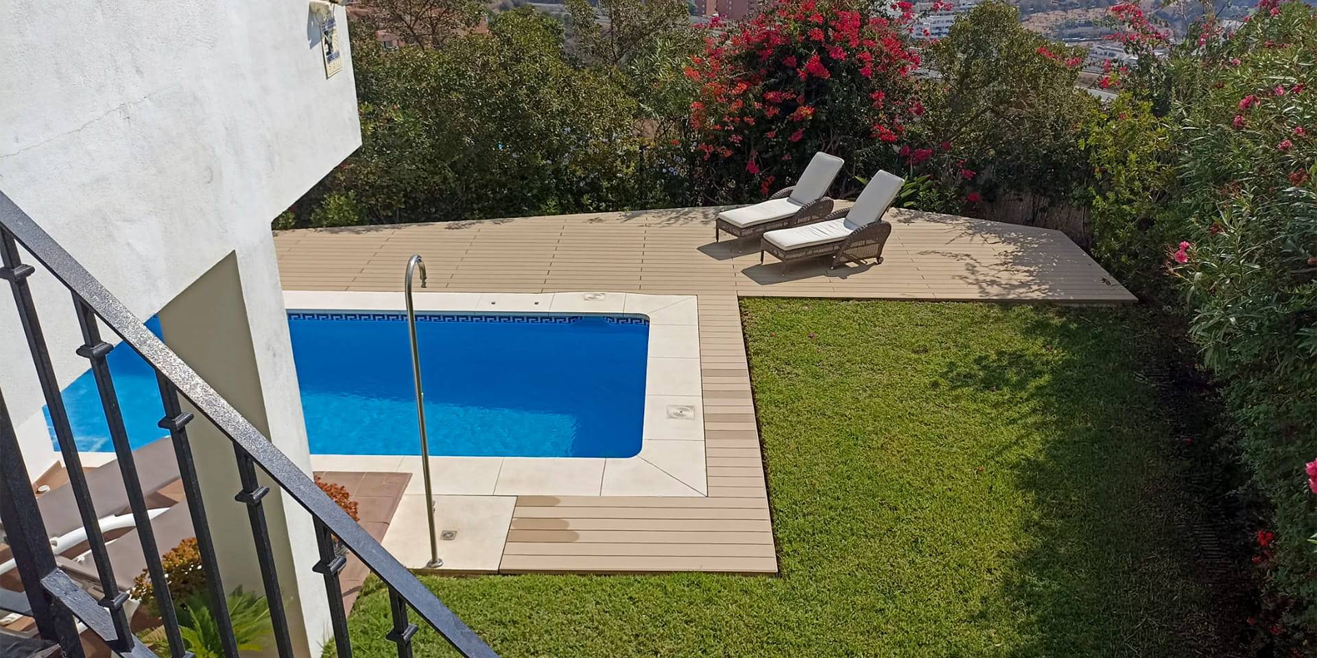 CDECK Original composite decking in beige beech colour in a pool area