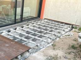 Composite decking installation with aluminium supports in a garden