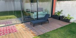 Garden with CDECK WUUDE composite decking in american walnut colour