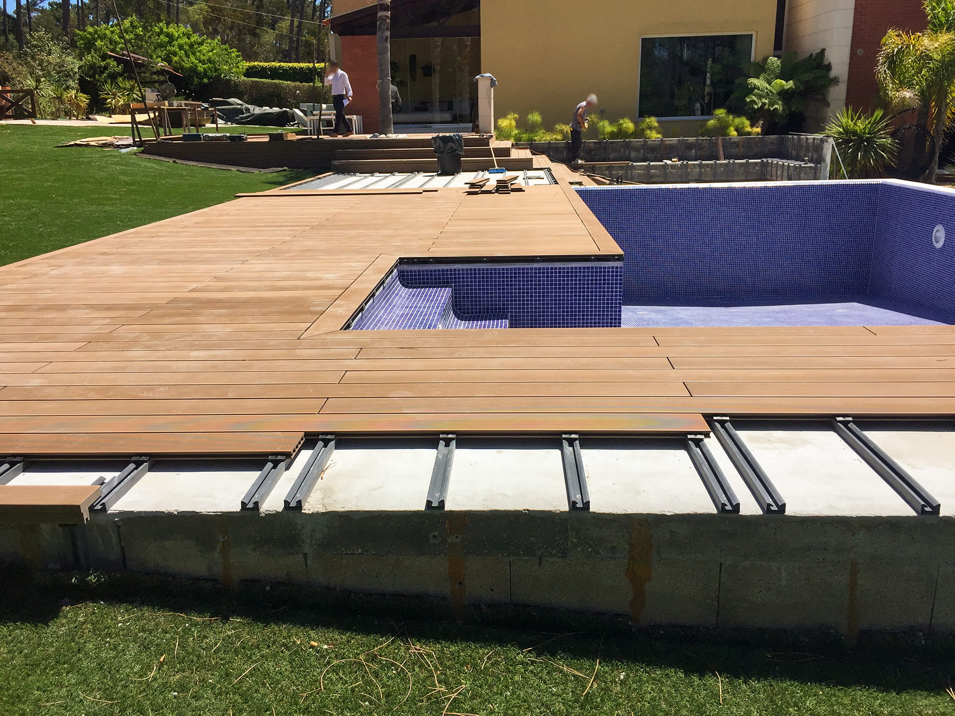CDECK composite decking installation in Redwood in a garden