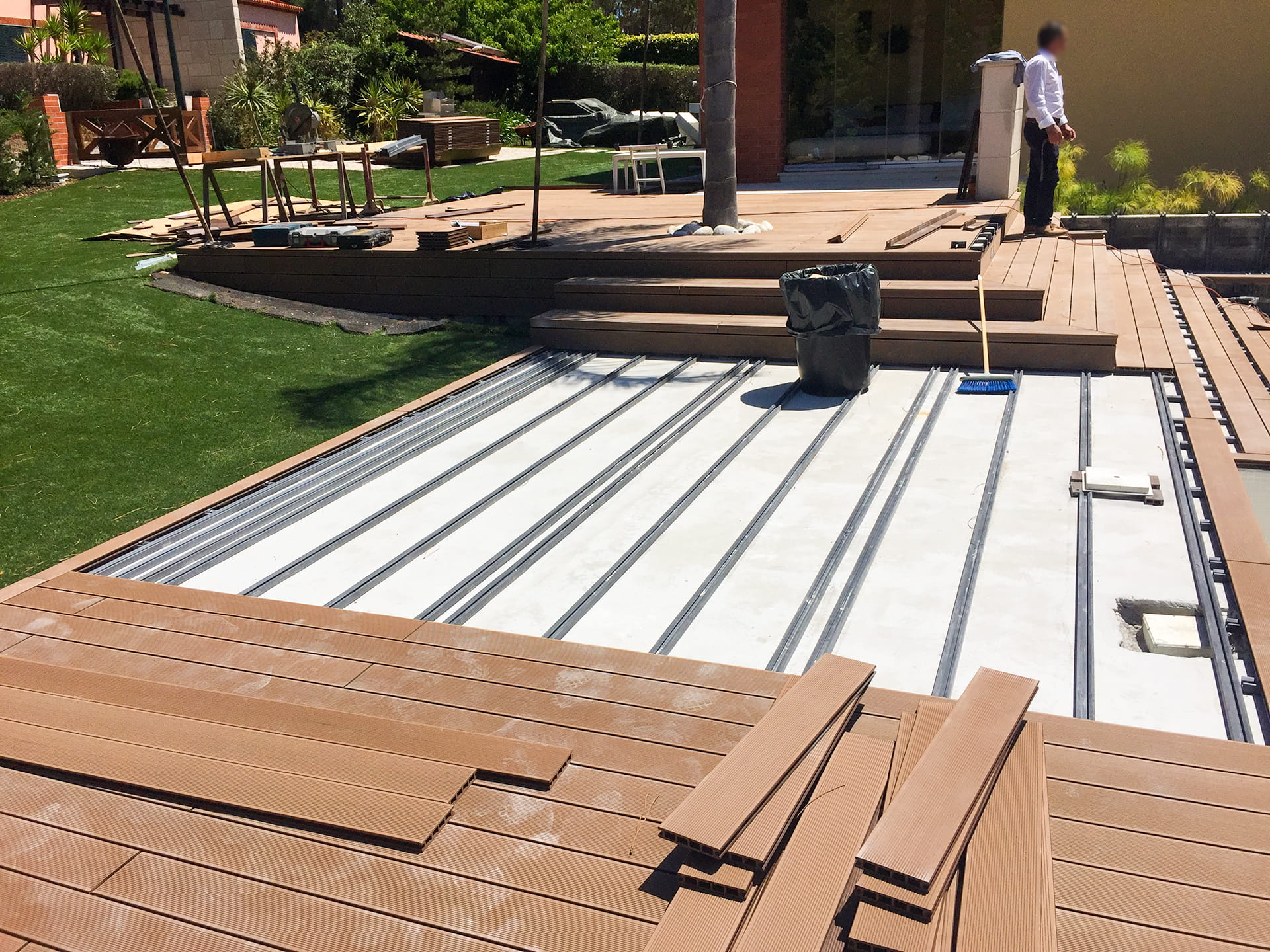 CDECK composite decking installation in Redwood in a garden
