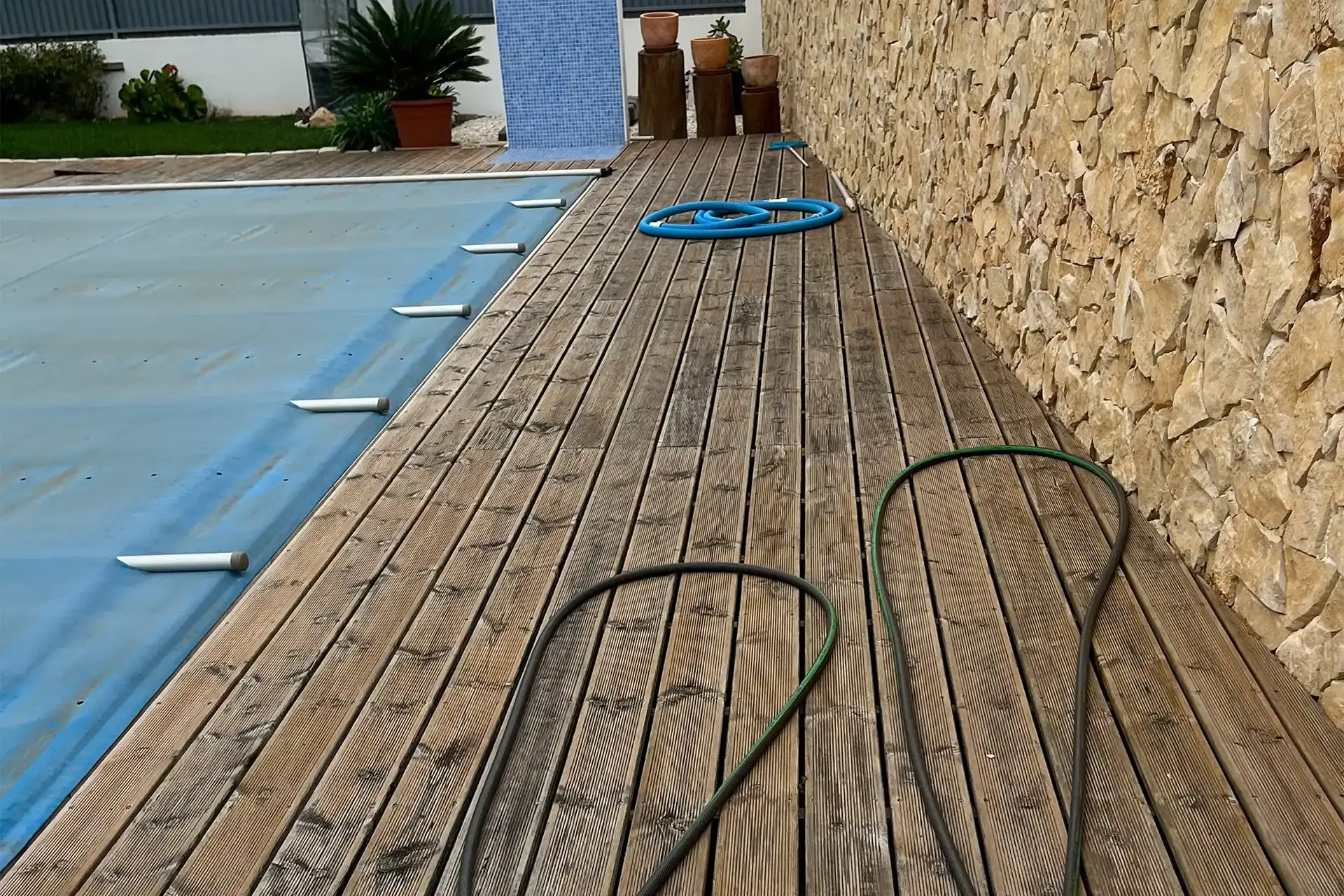 wooden decking installed in a pool area in a house in the Algarve