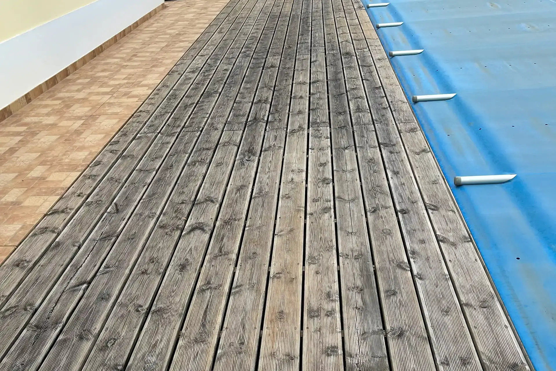 wooden decking installed in a pool area in a house in the Algarve