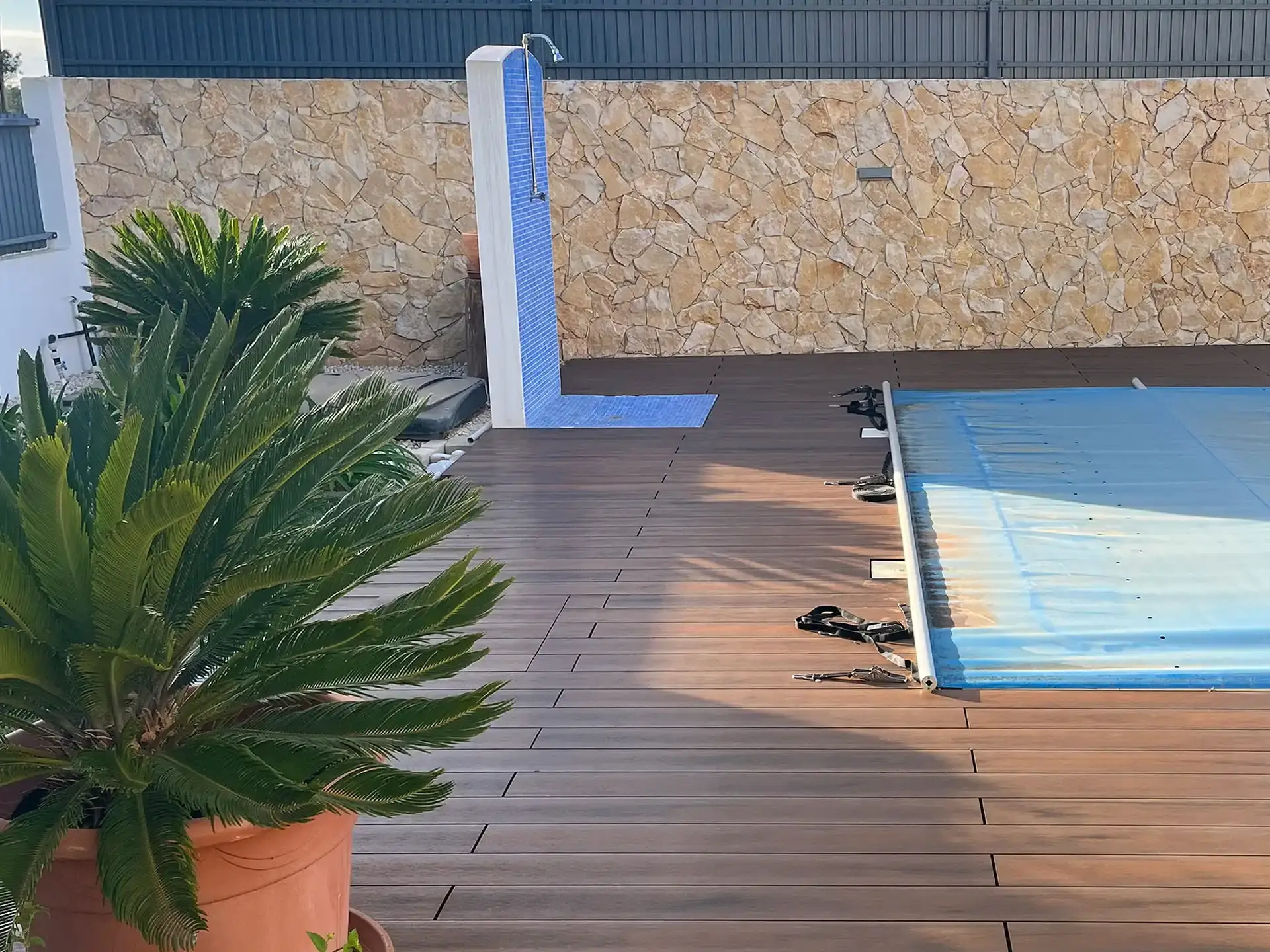CDECK WUUDE composite decking in American Walnut color installed in a pool area in a house in the Algarve