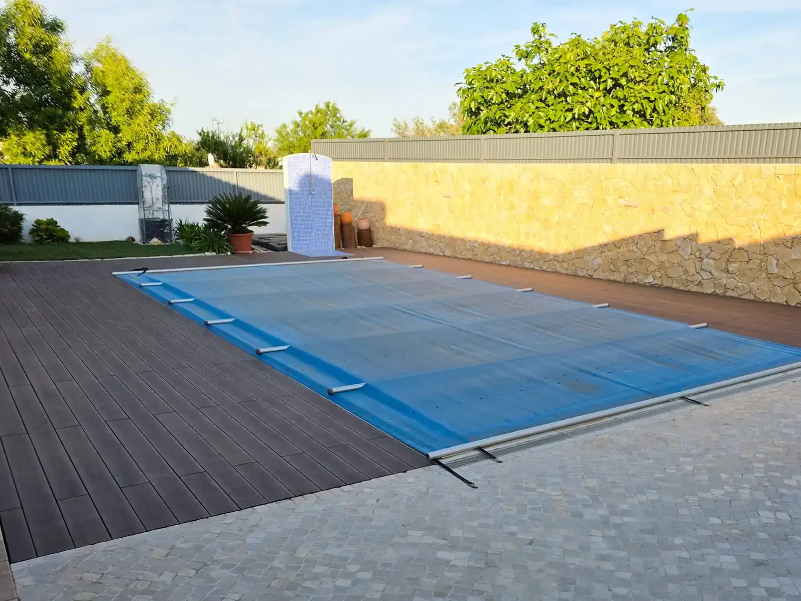 CDECK WUUDE composite decking in American Walnut color installed in a pool area in a house in the Algarve