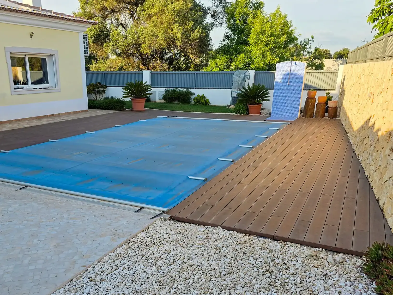 CDECK WUUDE composite decking in American Walnut color installed in a pool area in a house in the Algarve